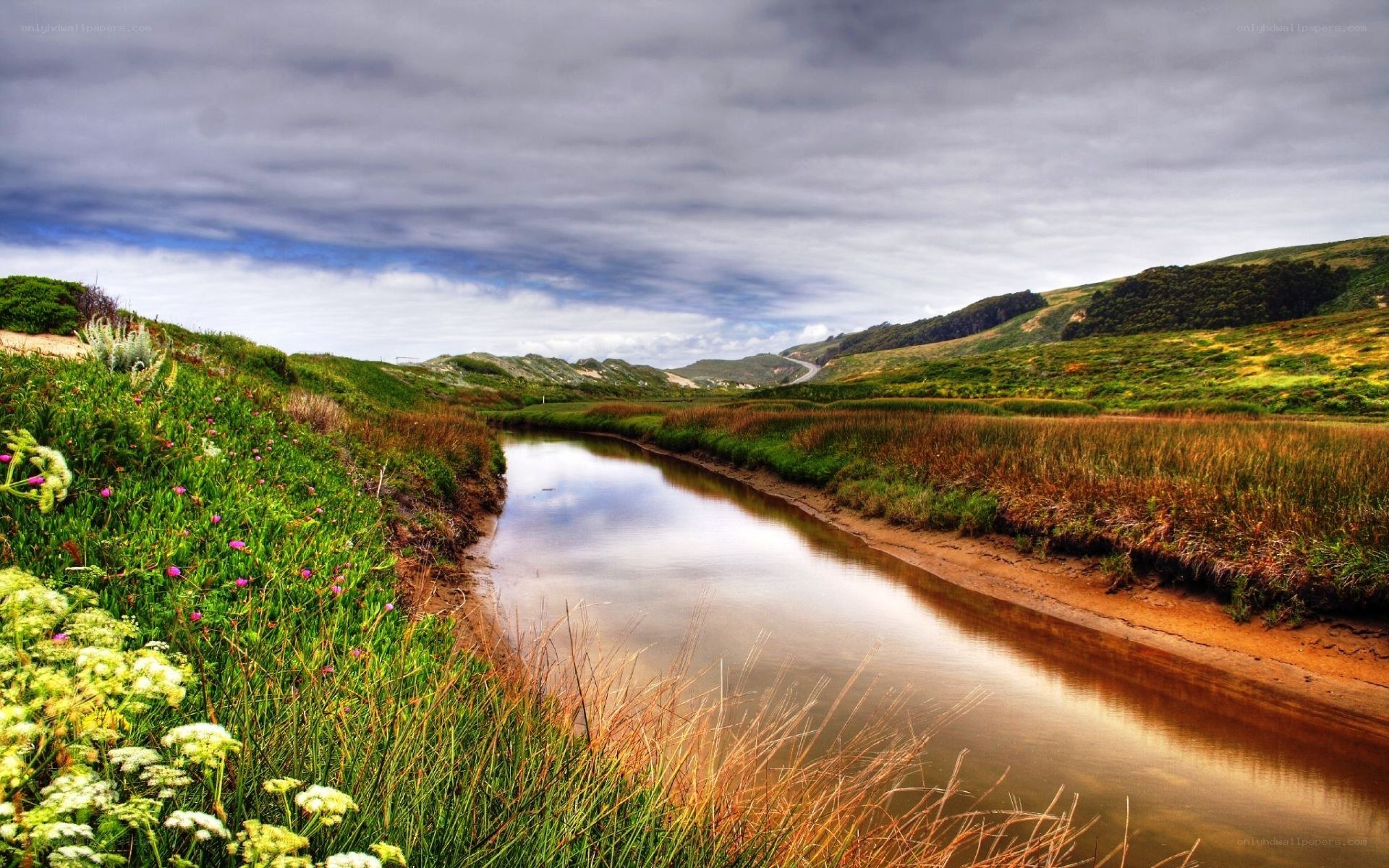 River through green hills
