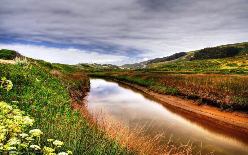 River through green hills