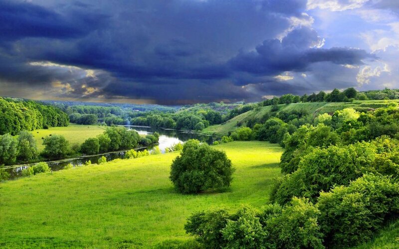 River Through Green Valley — Dramatic