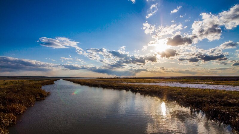 River Through Marshland — Blue, Serene, Sunset, Photograph