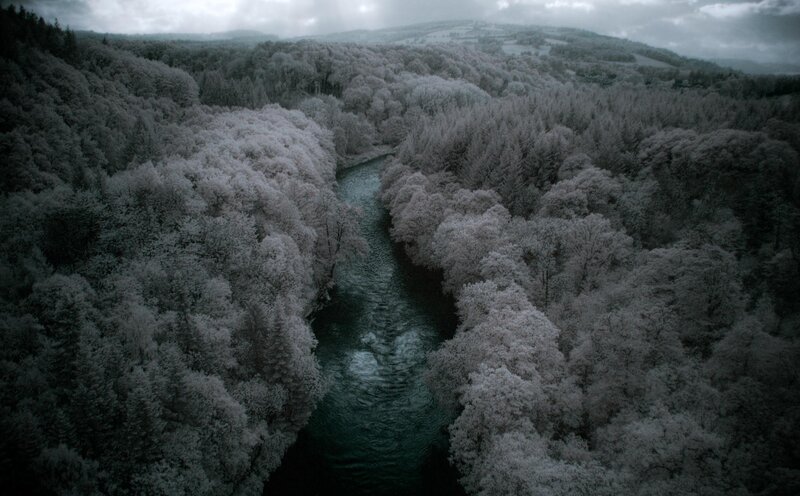 River Through Snowy Forest — Gray