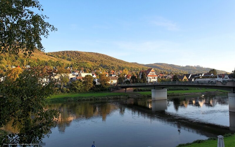River town with bridge and hills