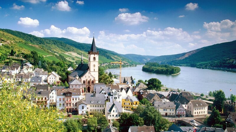 River town with church and hills