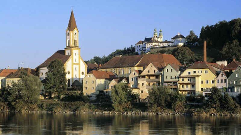 River town with church and hilltop castle