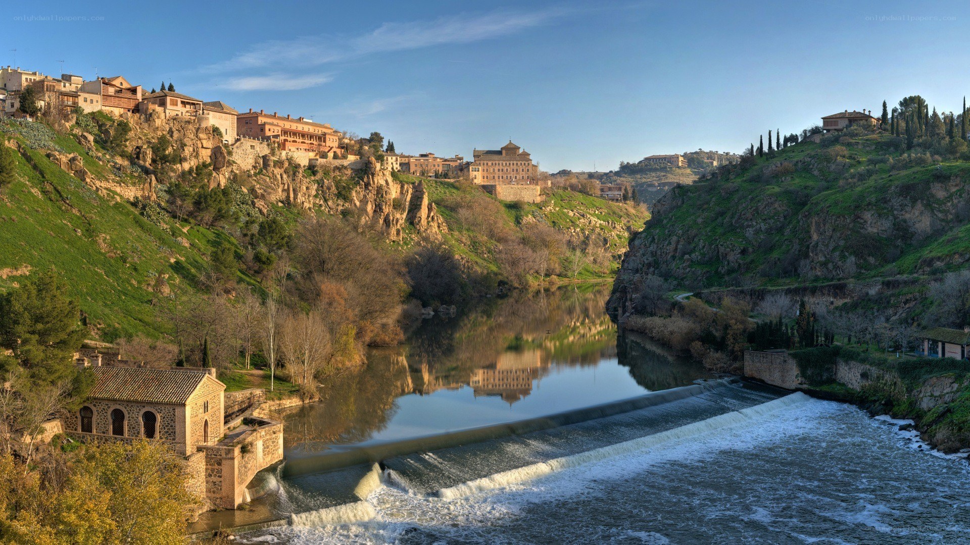 River town with dam and reflection