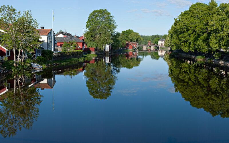 River town with red buildings