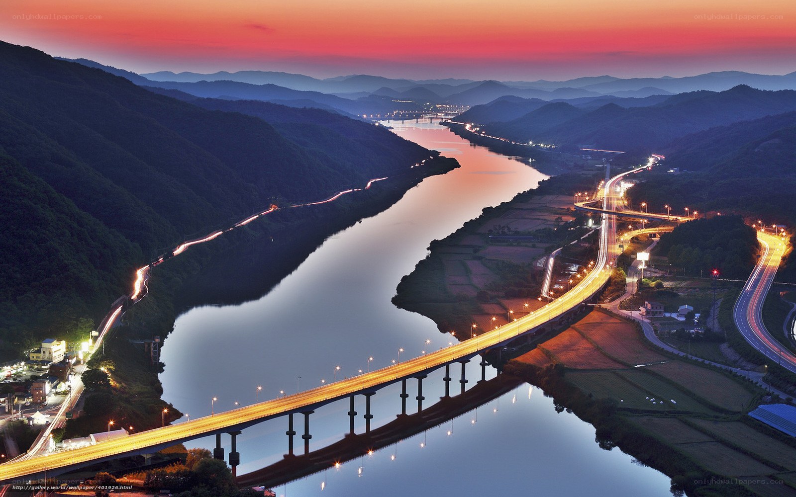 river valley at dusk with bridge