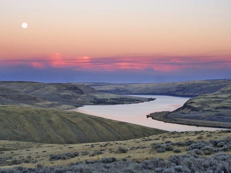 River valley at sunset with moon