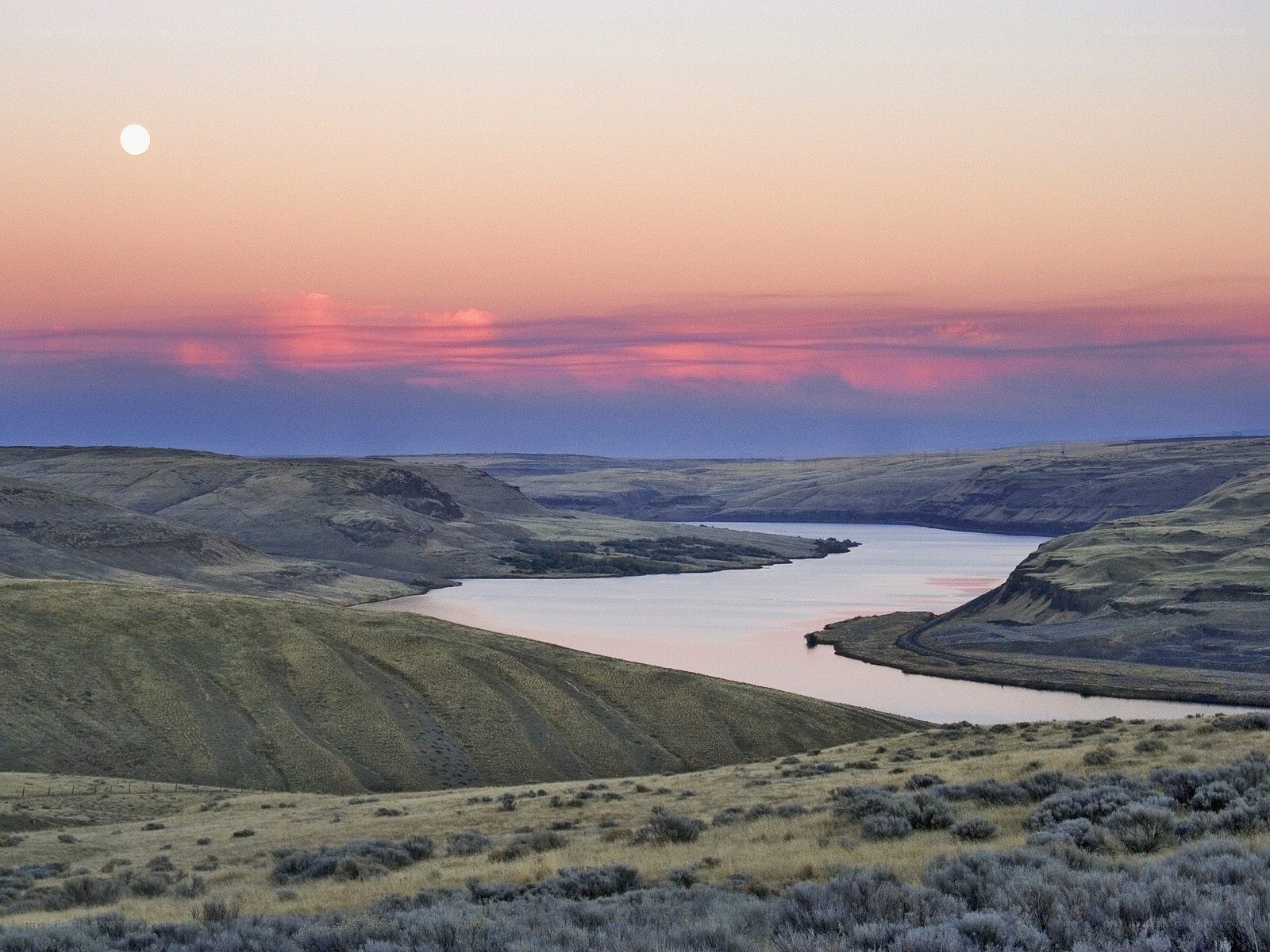 River valley at sunset with moon