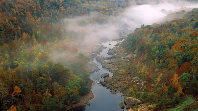 River valley in autumn mist
