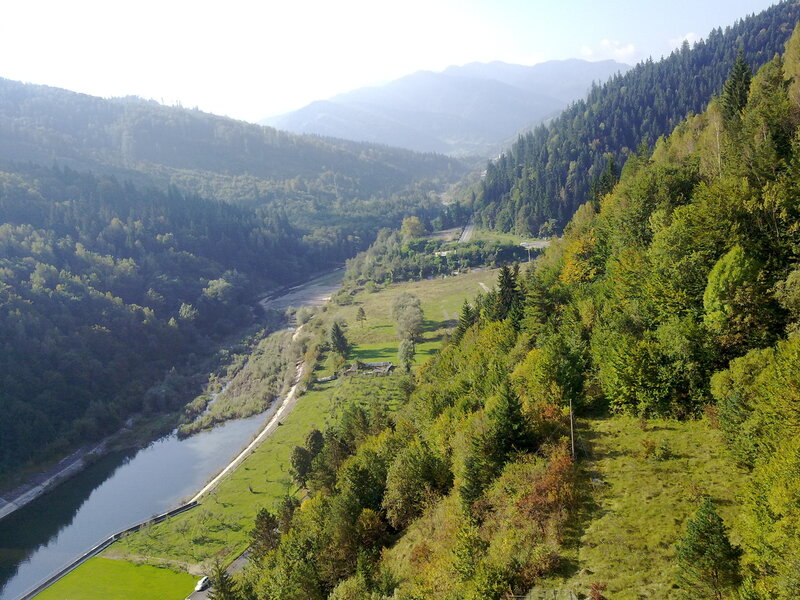 river valley in forested mountains