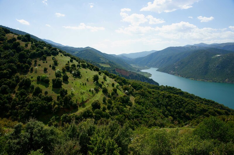 River Valley Landscape — Green, Serene, Afternoon, Photograph, Mountains, Trees, Sky