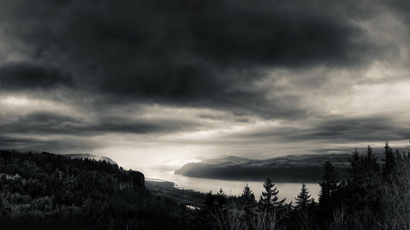 River Valley under Storm Clouds