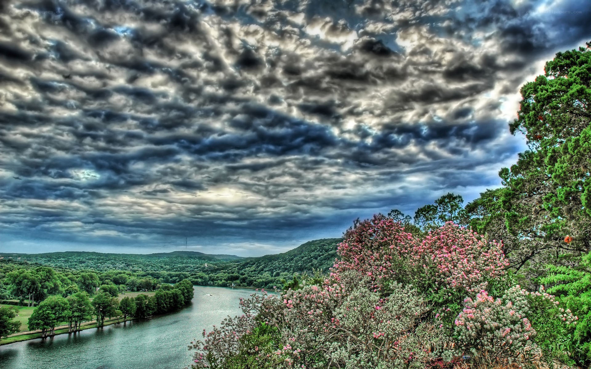 River valley under stormy sky