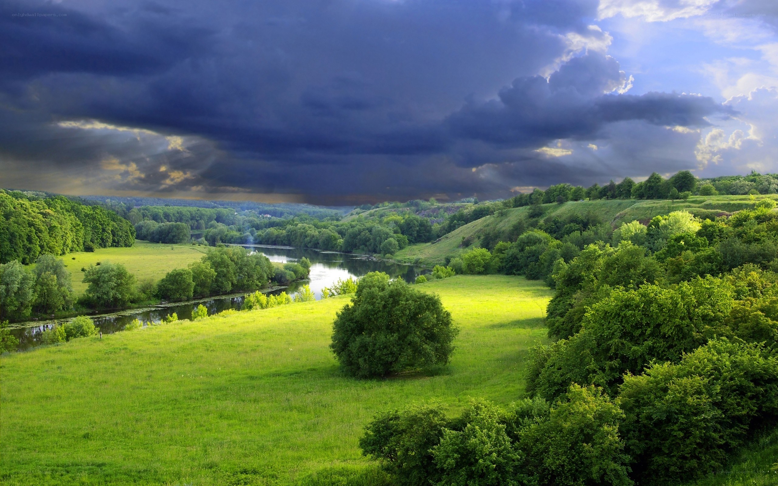 River valley under stormy sky