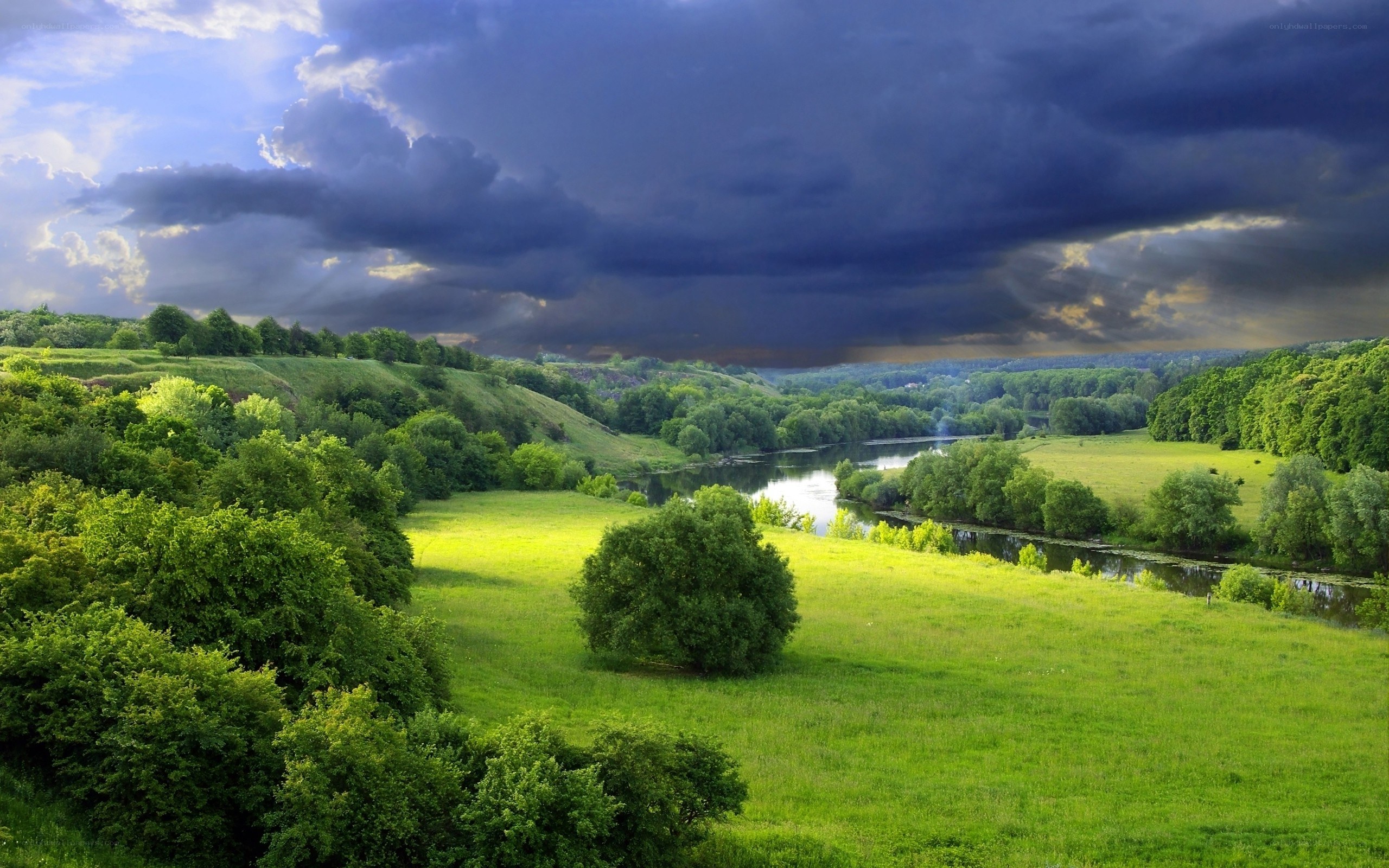 River valley under stormy sky