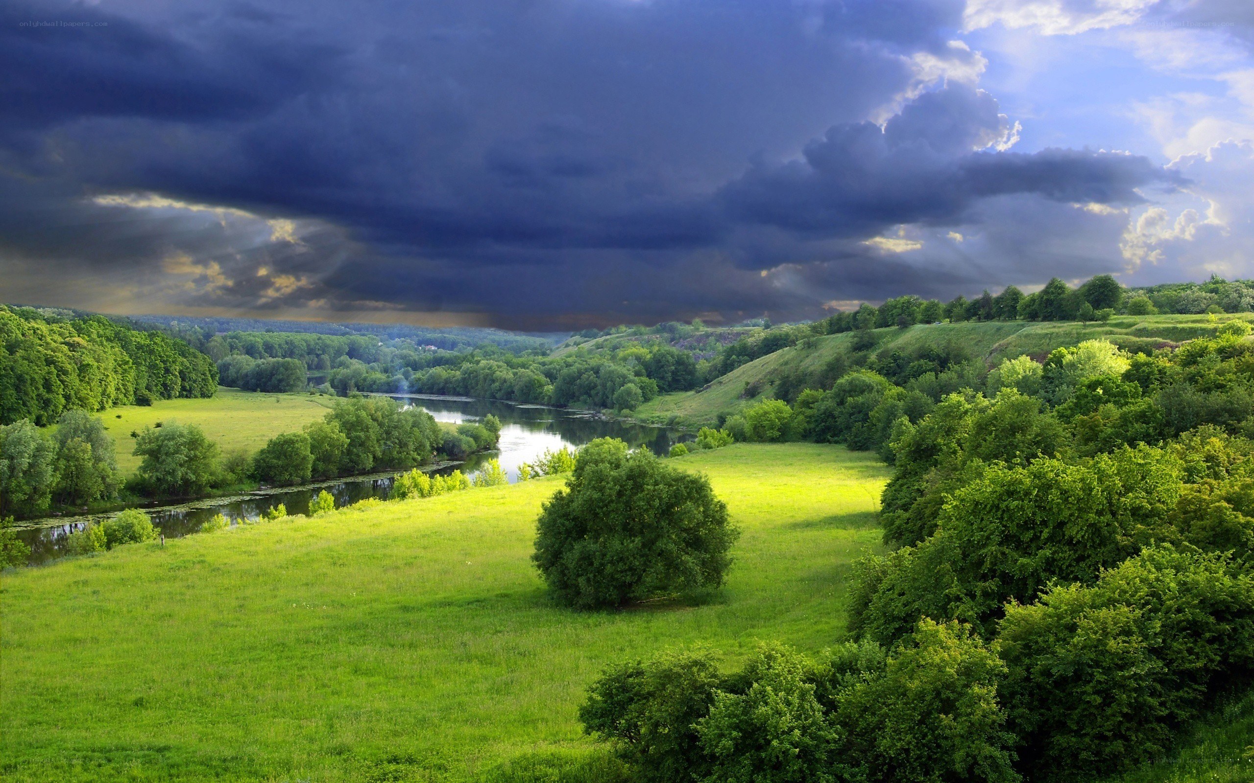 River valley under stormy sky