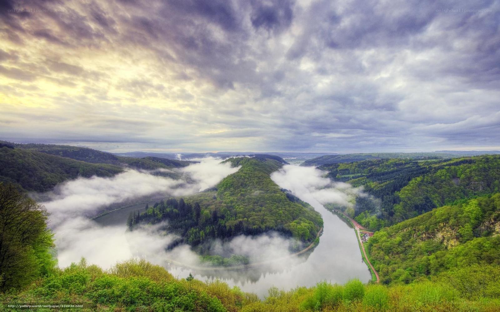river valley with fog and clouds