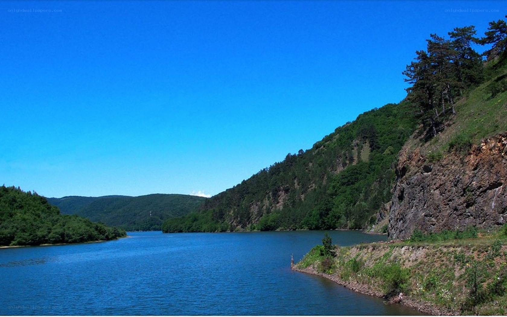 River valley with forested hills