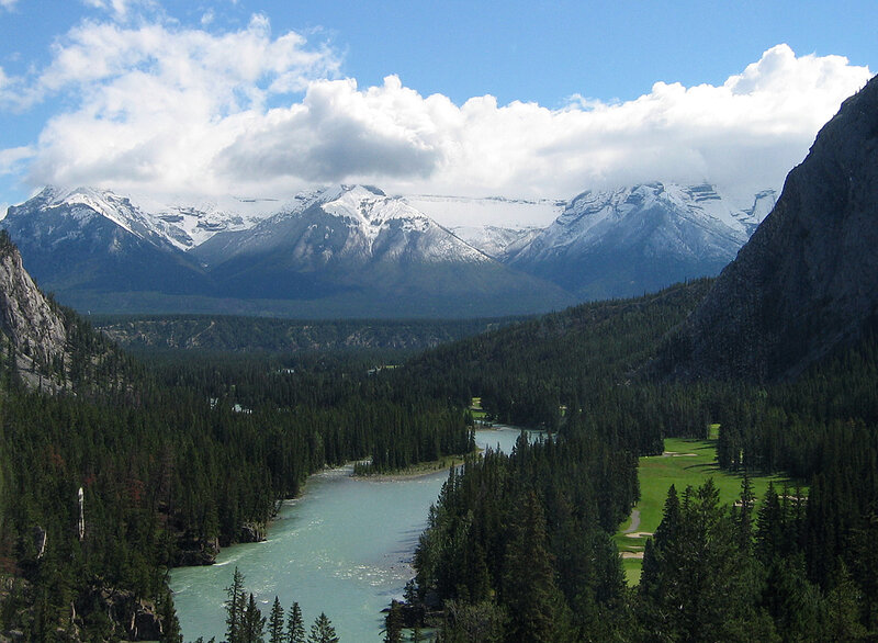 river valley with snow-capped mountains