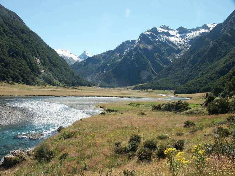river valley with snow-capped mountains