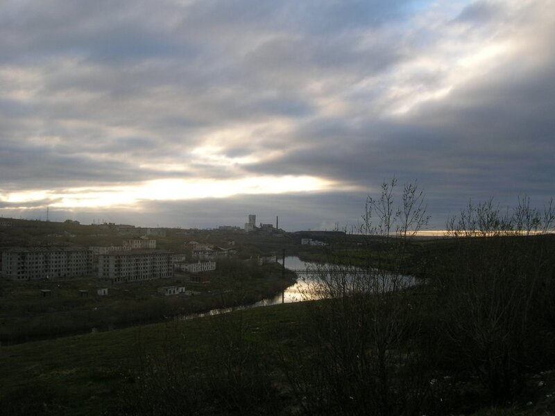 River view of a town at dusk