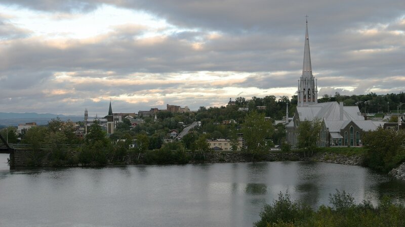 River view of a town with a church
