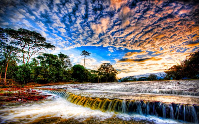 River Waterfall at Sunset — Blue, Dramatic, Photograph, Trees, Clouds