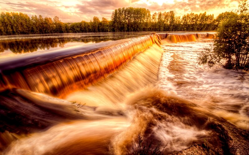 River Waterfall at Sunset — Orange, Dramatic