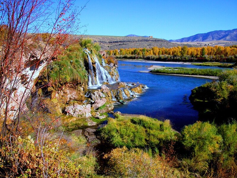 River waterfall in autumn landscape