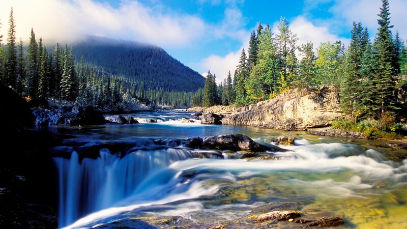 River Waterfall in Forest — Blue, Serene, Afternoon, Photograph, Mountain, Trees, Rocks, Green, Brown