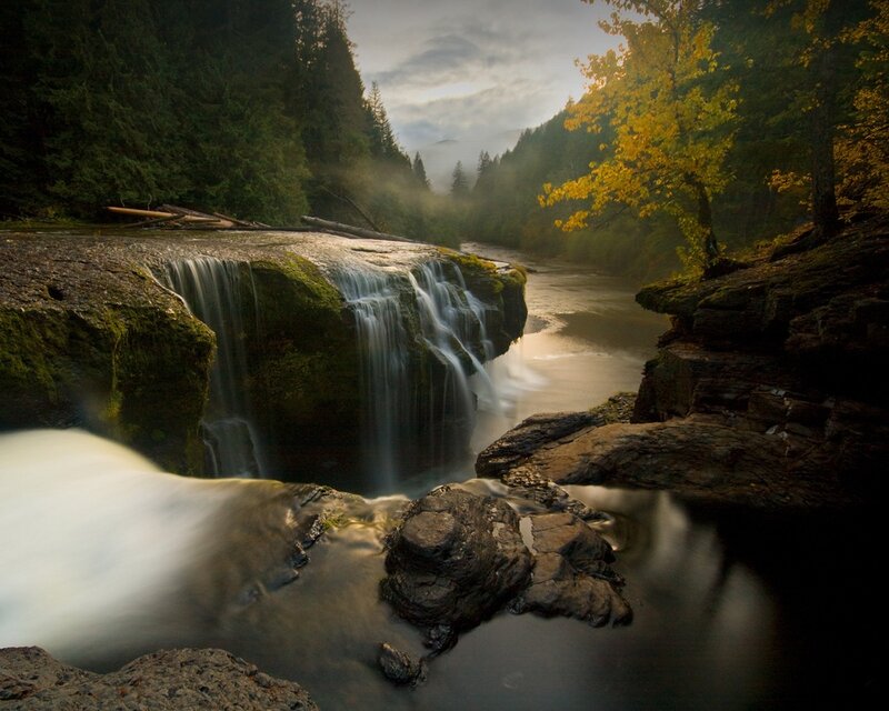 River Waterfall in Forest — Green, Serene, Autumn, Photograph, Trees, Rocks, Mist, Brown