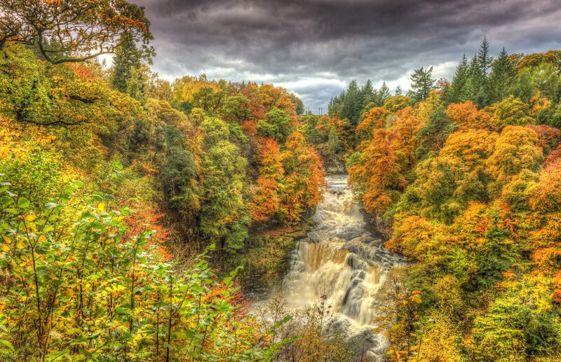 River Waterfall in Forest — Orange, Dramatic