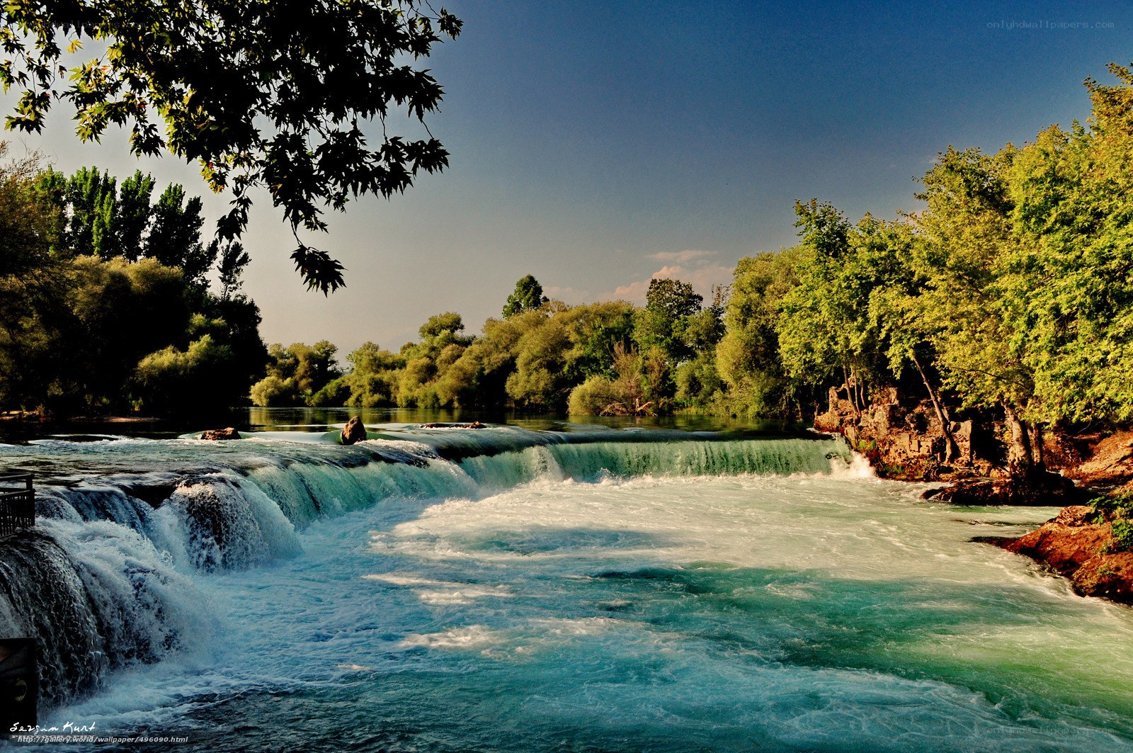 River waterfall in lush greenery