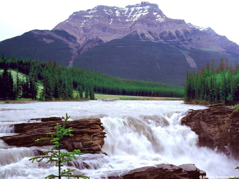 River waterfall with mountain backdrop