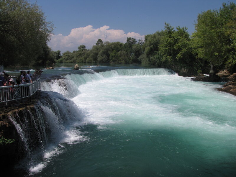 River Waterfall with Tourists