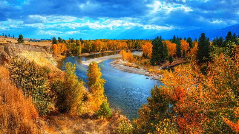 River Winding Through Autumn Forest — Blue, Dramatic