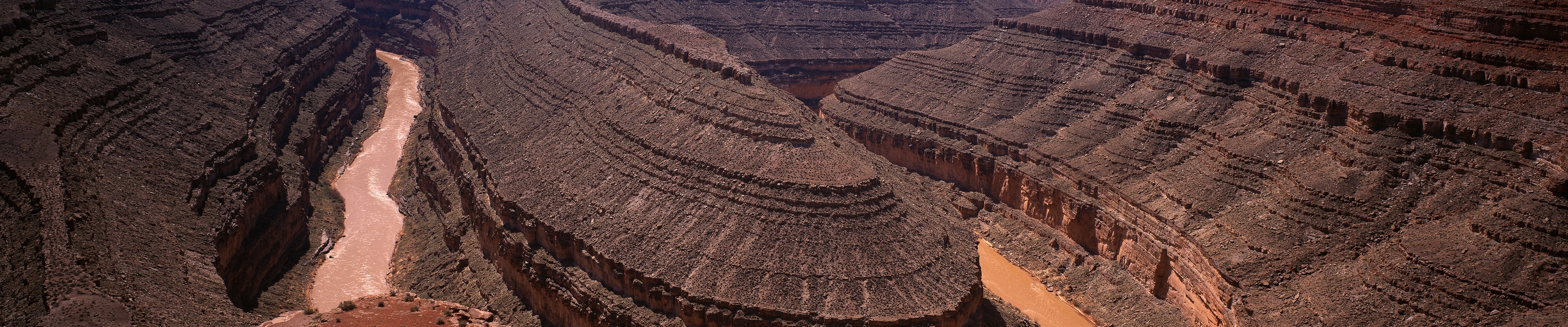 river winding through canyon