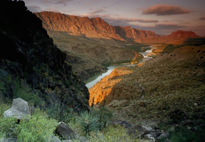 River winding through canyon at sunset