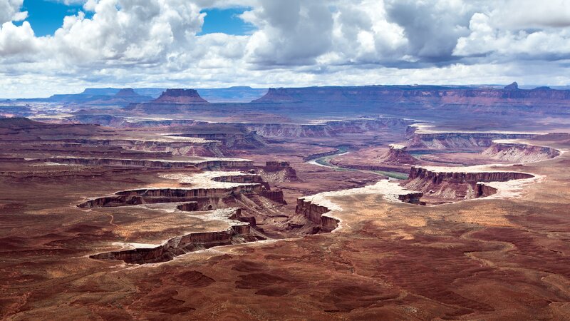 River Winding Through Canyon — Brown, Dramatic, Afternoon, Photograph, Clouds