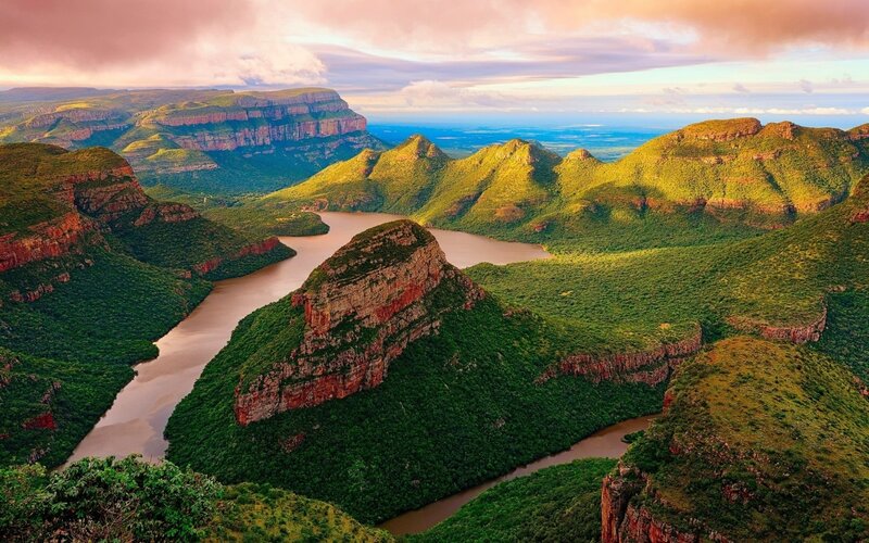 River Winding Through Canyon — Green, Serene, Sunset