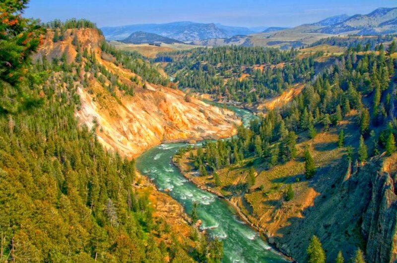River Winding Through Canyon — Green, Serene