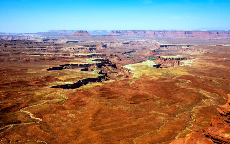 River Winding Through Canyon — Red, Arid