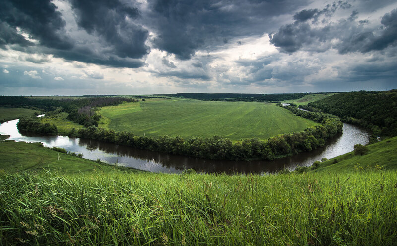River Winding Through Fields — Green