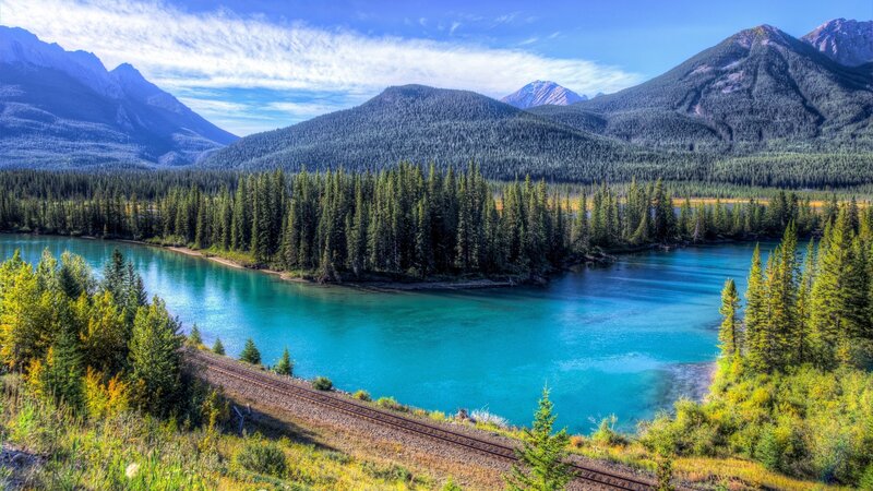 River Winding Through Forest — Blue, Serene, Afternoon, Photograph