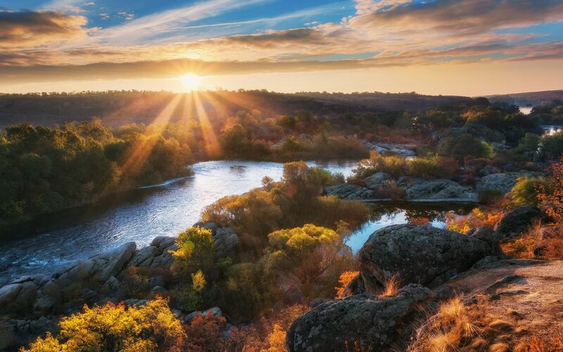River Winding Through Forest — Blue, Serene, Sunset