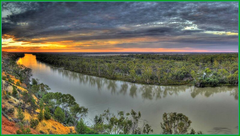 River Winding Through Forest — Green, Dramatic