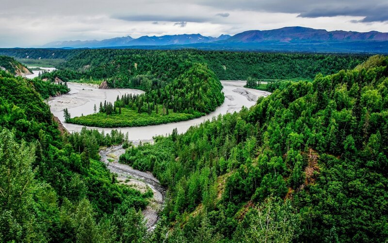 River Winding Through Forest — Green, Serene, Photograph, Mountains