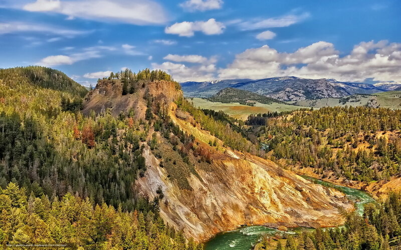 river winding through forested canyon