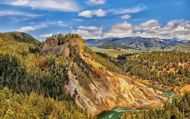 river winding through forested canyon